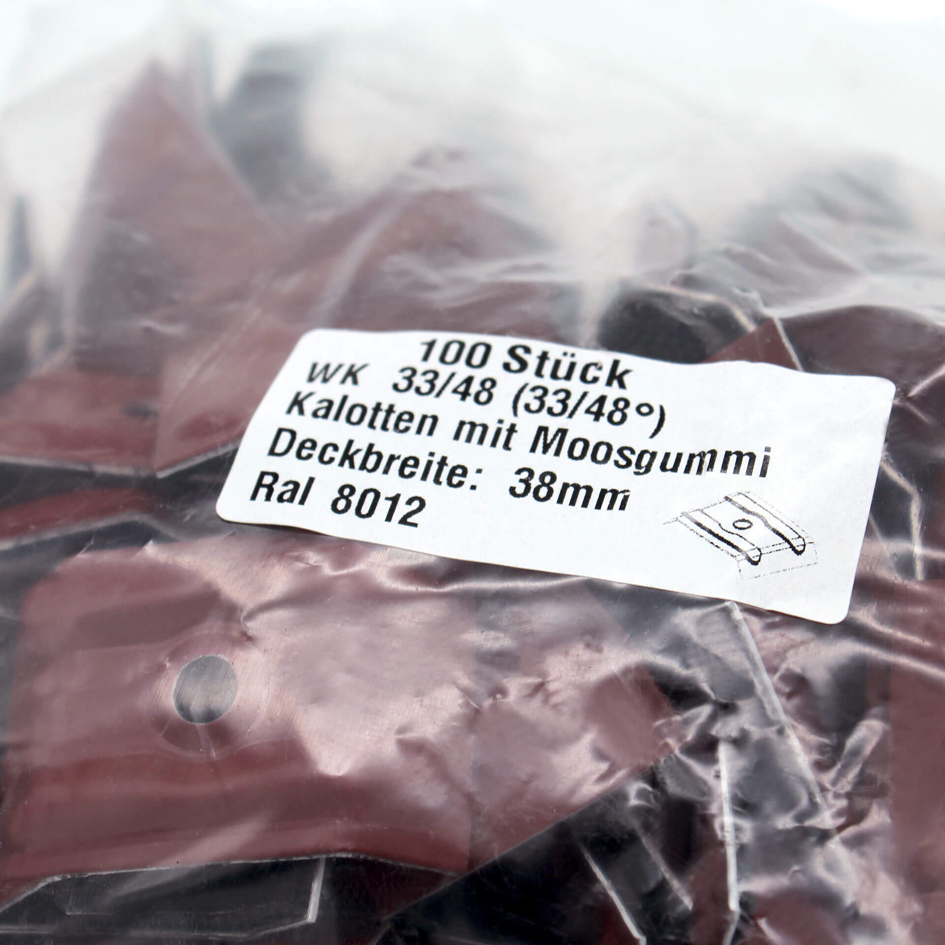 Verpackung mit Kalotten in Rotbraun, 33/48. Auf dem Aufkleber steht der Inhalt und technische Daten.