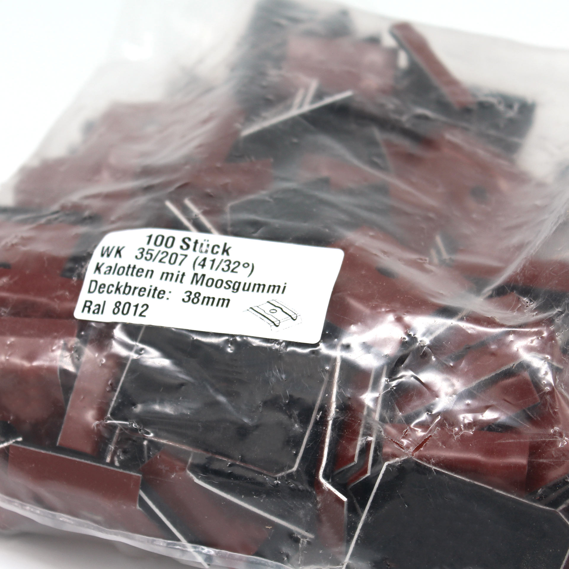 Verpackung mit Kalotten in Rotbraun. Auf dem Aufkleber steht der Inhalt und technische Daten.