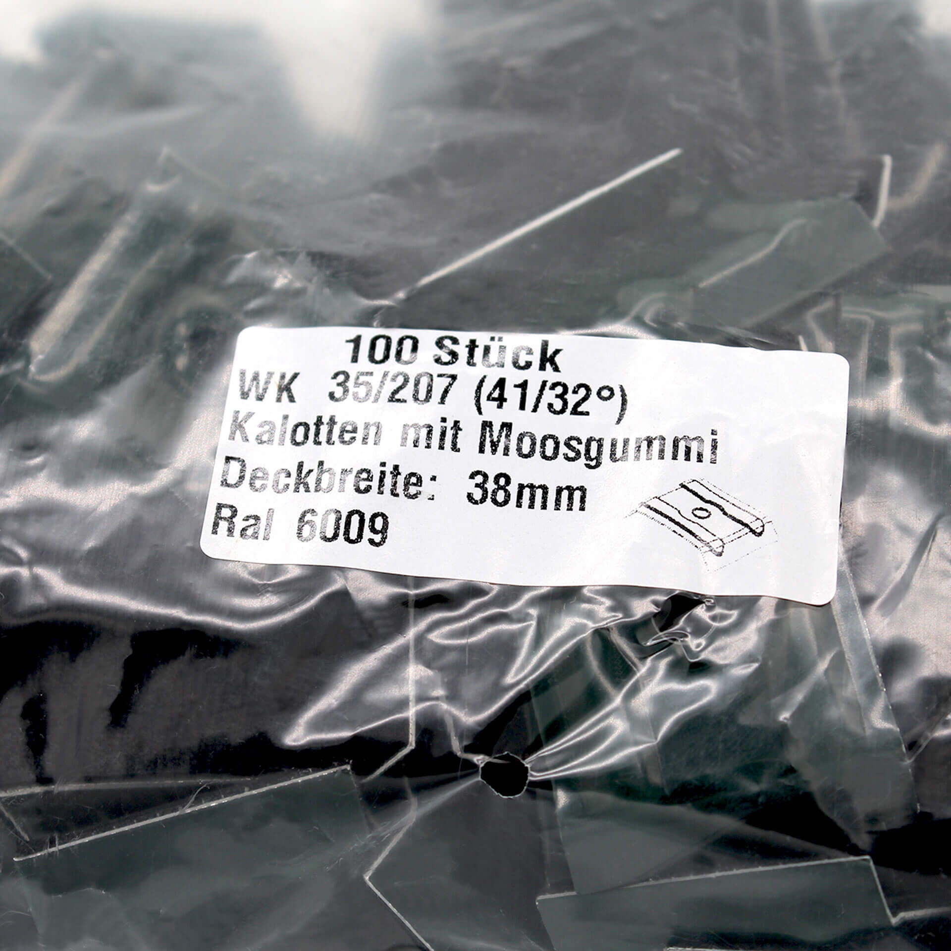 Verpackung mit Kalotten in Tannengrün. Auf dem Aufkleber steht der Inhalt und technische Daten.