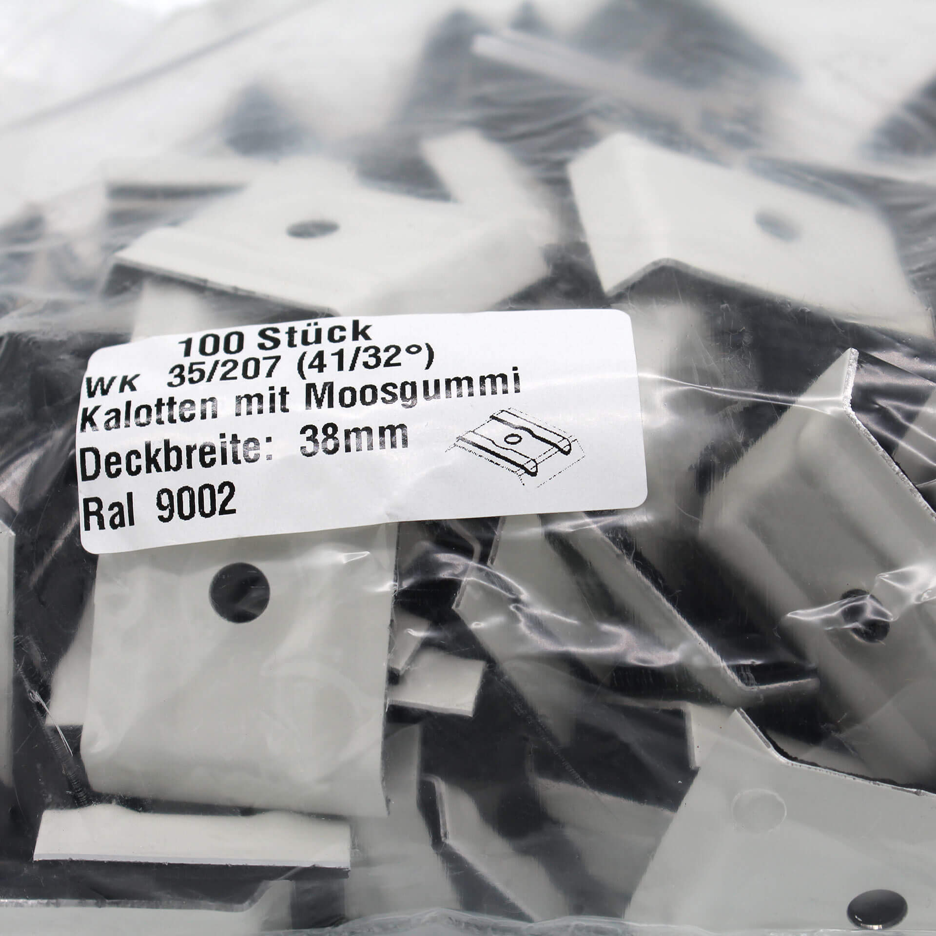 Verpackung mit Kalotten in Grauweiß. Auf dem Aufkleber steht der Inhalt und technische Daten.