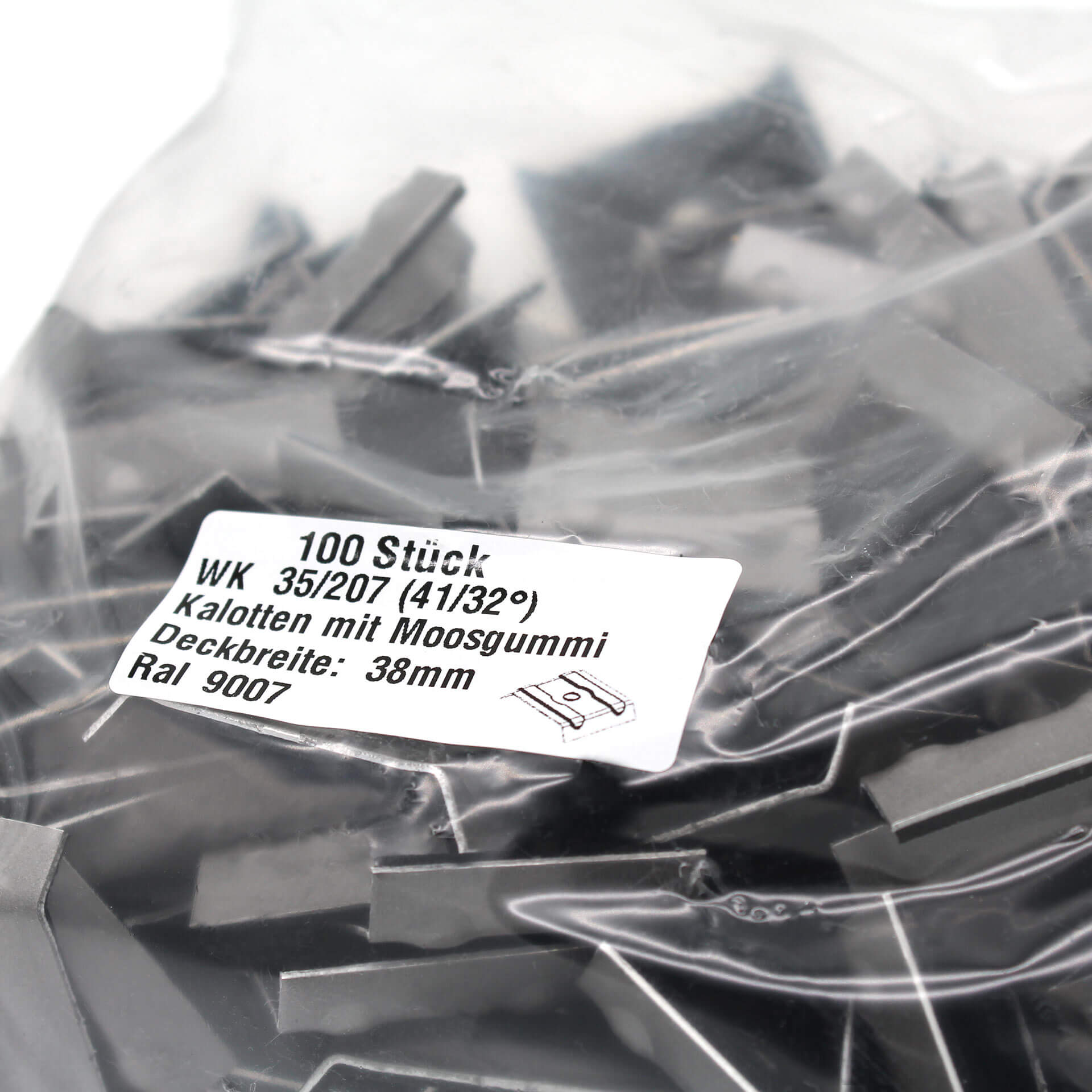 Verpackung mit Kalotten in grau. Auf dem Aufkleber steht der Inhalt und technische Daten.