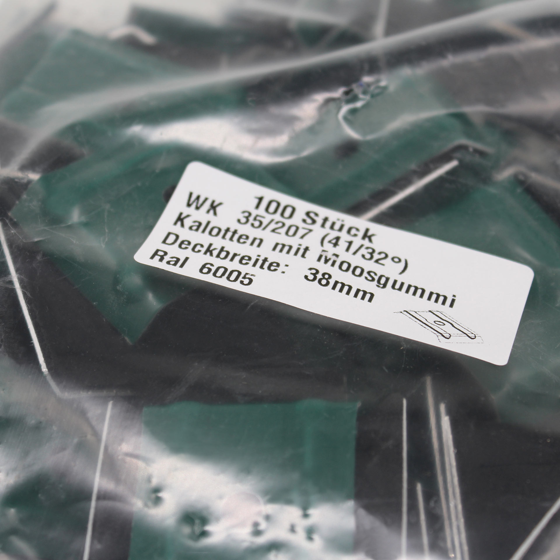 Verpackung mit Kalotten in Moosgrün. Auf dem Aufkleber steht der Inhalt und technische Daten.